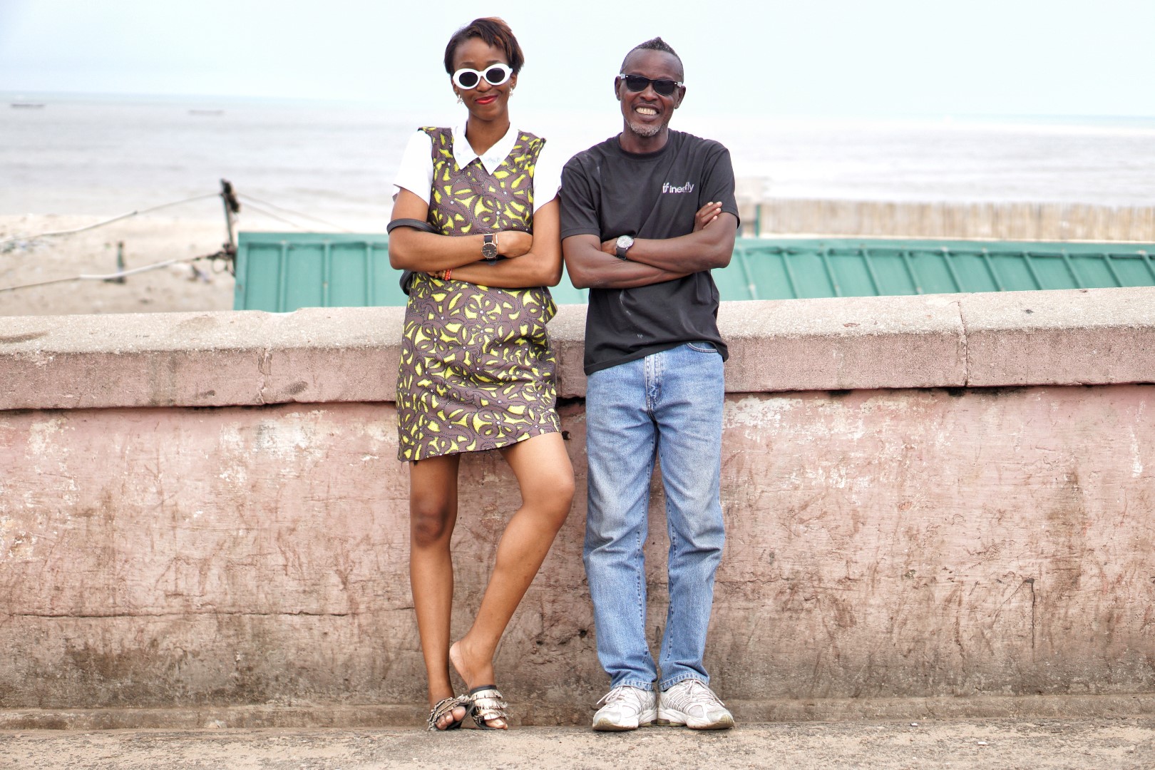 Nigerian blogger Cassie Daves sitting on a boat at the fishing village in jamestown Accra