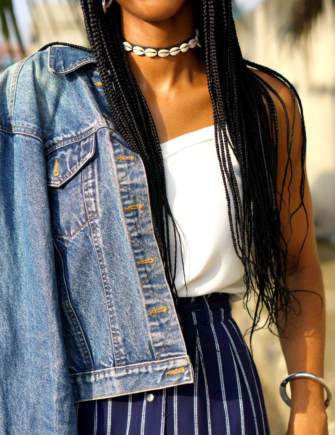 Nigerian blogger cassie daves in denim jacket and african inspired choker