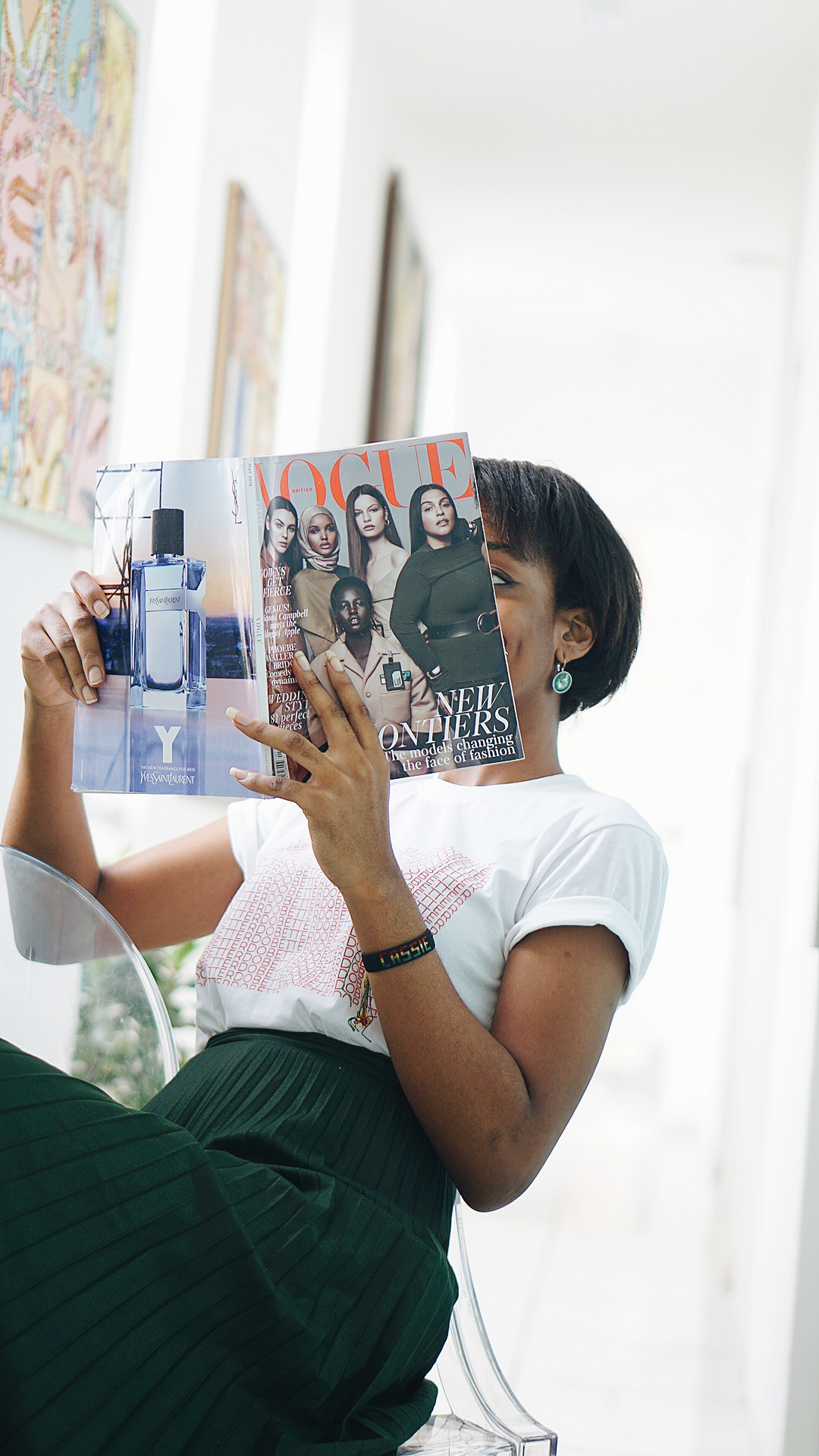 Nigerian Blogger Cassie Daves holding a magizine at tribe xx lab lagos