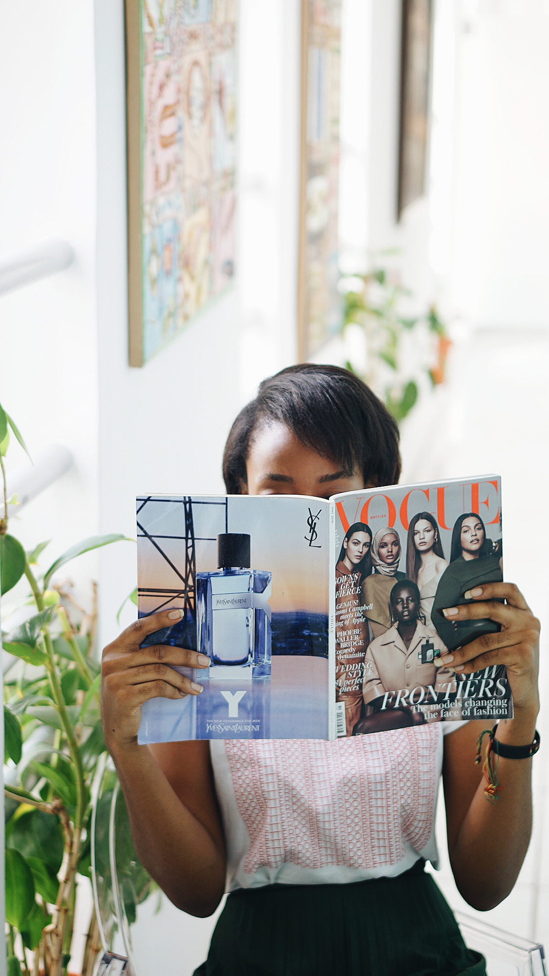 Cassie Daves holding a magizine at tribe xx lab lagos