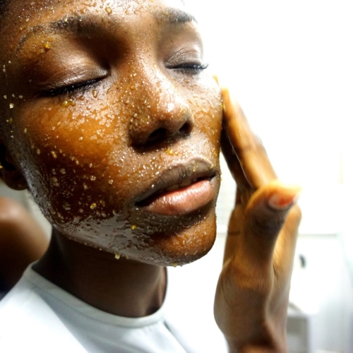 black model using DIY brown sugar and honey face scrub