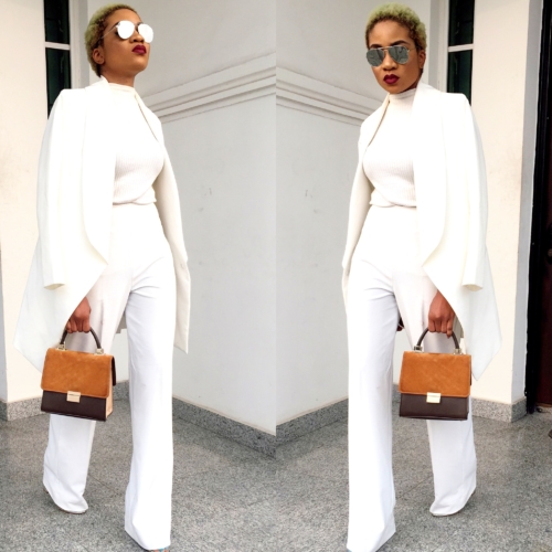 Nigerian fashion girl jennifer oseh, theladyvhodka in a gold two piece white suit and mirror sunshades