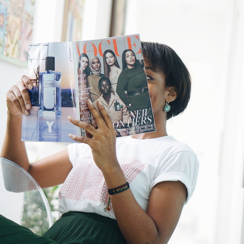 Nigerian Blogger Cassie Daves holding a magizine at tribe xx lab lagos