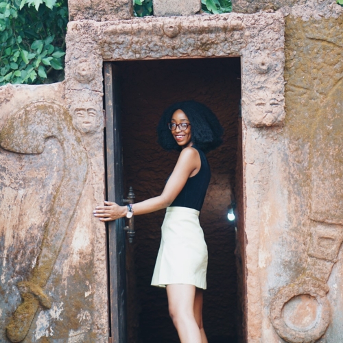 Nigerian Blogger Cassie Daves at the entrance to the tunnel at mount ned nwoko resort in idumuje ugboko