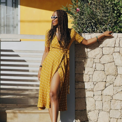 Travel blogger Cassie Daves in a Yellow polka dot dress in Cape Verde